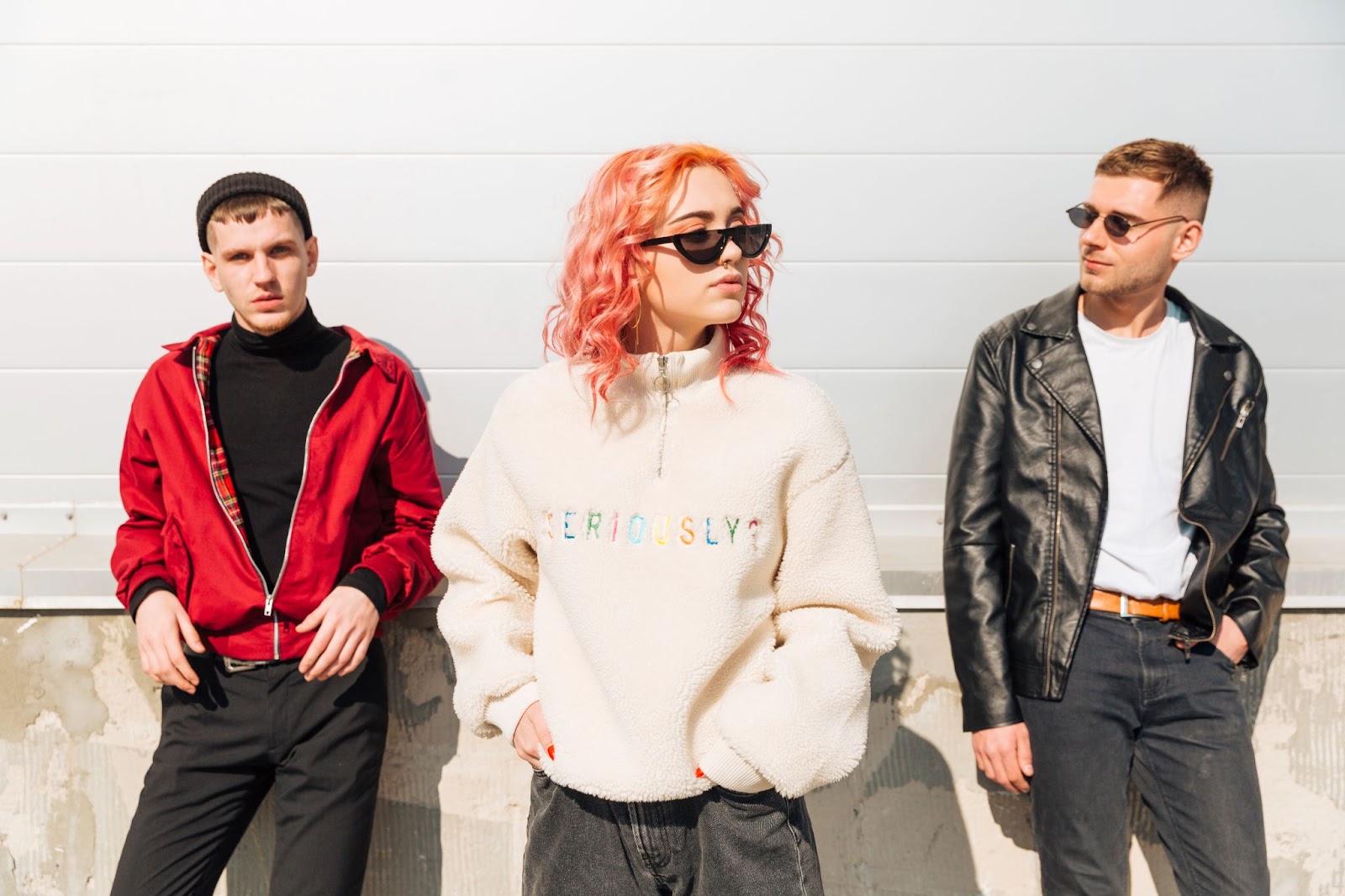 A cozy, oversized streetwear jacket paired with a stylish graphic t-shirt worn by a fashion-forward individual standing in an urban setting, showcasing a casual streetwear look.